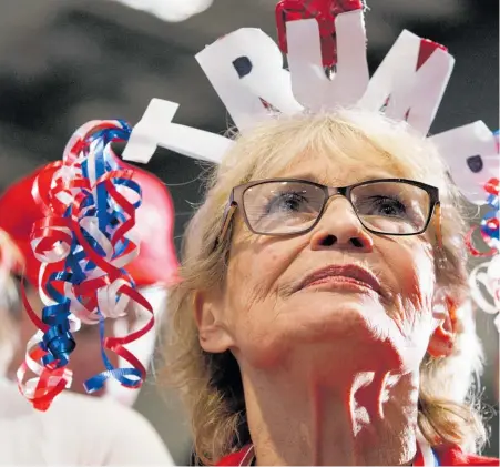  ??  ?? A supporter of US President Donald Trump listens to him speak at a campaign rally in Pensacola, Florida.