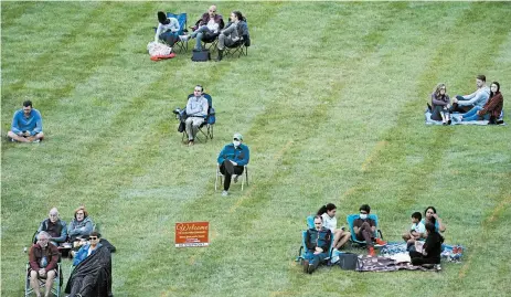  ?? CHARLIE RIEDEL/AP ?? A socially distanced crowd listens to the Kansas City Symphony on Sept. 19 in Missouri.