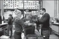  ?? AP/MANUEL BALCE CENETA ?? Ajay Kori (right) owner of UrbanStems, and Megan Sanders prepare fresh flowers for delivery last week at the company’s warehouse, in Washington.