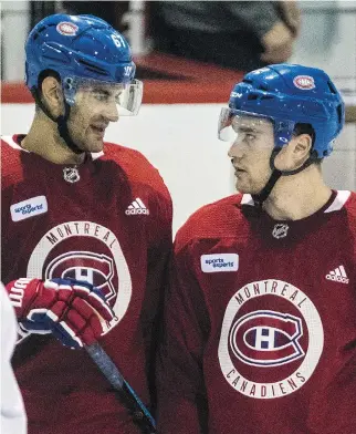  ?? DAVE SIDAWAY ?? Canadiens captain Max Pacioretty, left, chats with new teammate Jonathan Drouin during a practice last month at the Bell Sports Complex in Brossard. Drouin is often among the last players off the ice at practice.