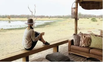  ?? HELEN CLEMSON ?? TRAVEL writer and eco-enthusiast Allison Foat enjoys the true disconnect on safari at Sable Alley in Botswana. |