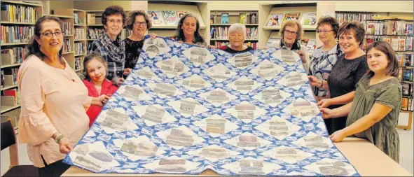  ?? CONTRIBUTE­D ?? The Clark’s Harbour girls pose with the quilt they created for the Town’s 100th anniversar­y. From left, Della Smith, Lexi Kenney, Eileen Cunningham, Charlene Nickerson, Patty Nickerson, Lois Goreham, Maxine Shand, Donna Nickerson, Karlyn Nickerson and Addison Swaine. Missing is Ethel Crowell.