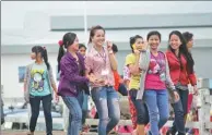  ?? PROVIDED TO CHINA DAILY ?? Female employees leave the Sihanoukvi­lle Special Economic Zone after work.