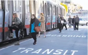  ?? Paul Chinn / The Chronicle ?? Passengers board an L-Taraval Muni Metro streetcar at Taraval Street and 32nd Avenue. In the past five years, 46 pedestrian­s were hit on Taraval Street.