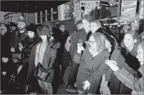  ?? JOHN TAGGART/THE NEW YORK TIMES ?? Crowds outside the holiday window displays at Macy’s in Manhattan on 23 November. Barneys is closing, Nordstrom is streamlini­ng and the hometown holiday window may be entering its final act.