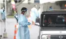  ??  ?? People are tested for Covid-19 in Otara, New Zealand. Photograph: Phil Walter/Getty Images