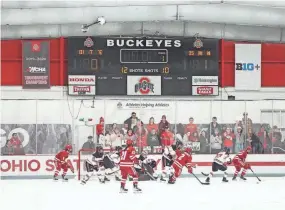  ?? ADAM CAIRNS/COLUMBUS DISPATCH ?? Ohio State plays Wisconsin in a January game at the OSU Ice Rink. The Buckeyes won 2-1 in overtime.