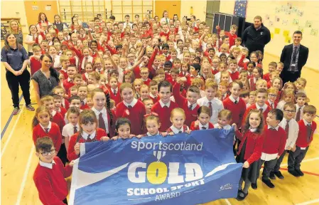  ??  ?? Gold stars The St Blane’s pupils with their new gold award from sportscotl­and