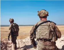  ?? AP ?? US soldiers survey the safe zone between Syria and the Turkish border near Tal Abyad, Syria, on a joint patrol with the Tal Abyad Military Council, on Friday.