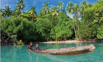  ?? ?? Boys fishing in the Solomon Islands. By 50,000 years ago, humans had migrated there, and to Australia and New Guinea. Photograph: Robert Harding/Alamy