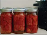  ??  ?? About three pounds of tomatoes will fill 1-quart jars nicely.