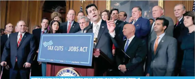  ??  ?? WASHINGTON: US House Speaker Paul Ryan of Wis, joined by House Republican­s, speaks to the media following a vote on tax reform, on Capitol Hill in Washington. —AP