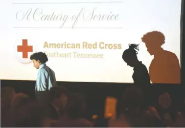  ?? STAFF PHOTOS BY TIM BARBER ?? Nicolas Davis, left, and Marquise Davis leave the stage Wednesday after receiving their Youth Hero awards for using CPR to save someone’s life.