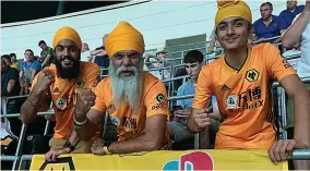  ??  ?? Ready for kick-off...Wolves fan Manny with sons Jeevan and Satnam