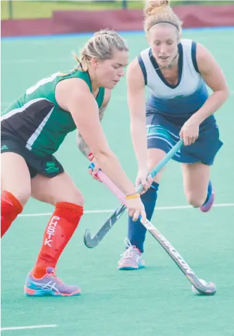  ??  ?? INCOMING: Geelong's Tatiana Rouch moves in to tackle a Powerhouse opponent at Stead Park on Saturday. LEFT: Geelong keeper Ben Champion dives to save a penalty corner against Gippsland in the men’s match.