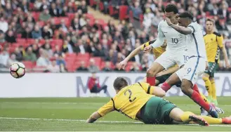  ??  ?? Jermain Defoe slots home England’s opener at Wembley