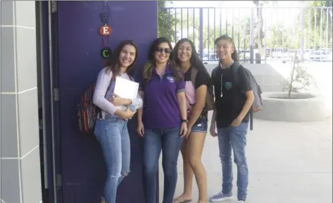  ?? ALEXIS PREECE PHOTO ?? Southwest High School history teacher Cindy Garcia (center) stands by the door to welcome her students to class before every period.