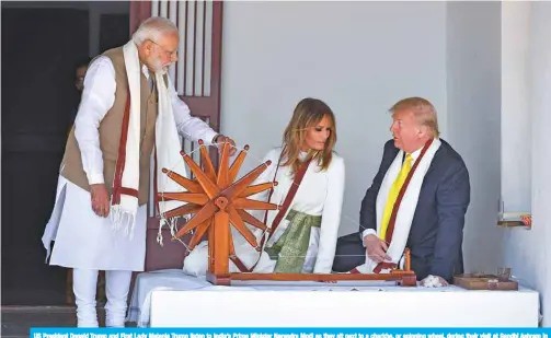  ?? — AFP ?? US President Donald Trump and First Lady Melania Trump listen to India’s Prime Minister Narendra Modi as they sit next to a charkha, or spinning wheel, during their visit at Gandhi Ashram in Ahmedabad yesterday.