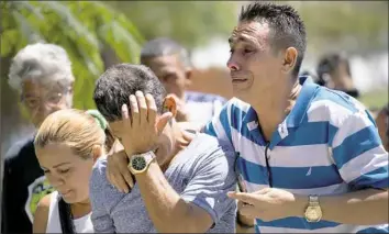  ?? Ramon Espinosa/Associated Press ?? Grieving relatives of passengers who perished in Cuba’s worst aviation disaster arrive Saturday at the morgue in Havana, Cuba. Investigat­ors are trying to determine why an aging Boeing 737 carrying more than 100 people crashed and erupted in flames...