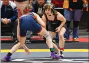  ?? STEVE HARE — FOR THE NEWS-HERALD ?? Mentor’s Lorelai Megery squares off in the first OHSAAsanct­ioned girls state wrestling tournament on March 10.