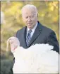  ?? ?? President Joe Biden checks out Peanut Butter during the humor-filled ceremony in the Rose Garden.
