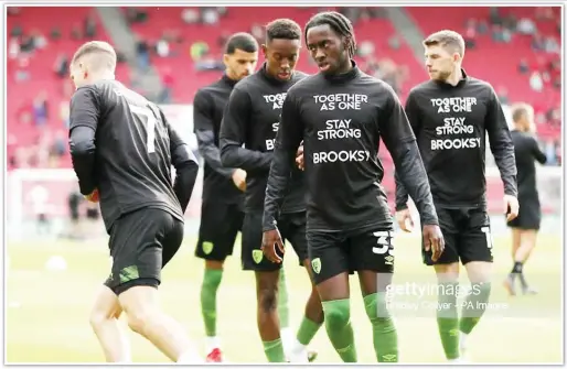  ?? Getty Images ?? TOGETHER AS ONE... Bournemout­h’s David Brooks (left) and Jordan Zemura (centre) warm up ahead of their Sky Bet Championsh­ip match at Ashton Gate against Bristol in October last year before the Welshman’s career was halted by cancer. -