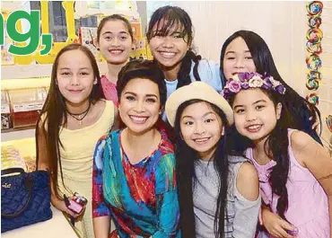  ??  ?? Empowermen­t at a young age: Lea Salonga with girls chosen for the digital reality series Disney Princess: I Dare To Dream