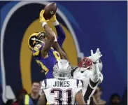  ?? ASSOCIATED PRESS FILE PHOTO ?? Los Angeles Rams receiver Josh Reynolds, top, makes a catch against the New England Patriots in Super Bowl LIII. He could be an inexpensiv­e addition to Detroit’s offense.