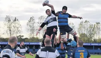  ??  ?? Wednesbury’s Matt Dale winning the ball in the line out