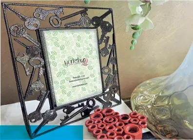  ??  ?? Recycled key photoframe from WorkshopQ