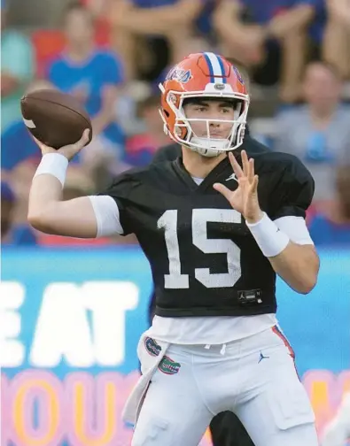  ?? UF JOHN RAOUX/AP ?? Florida quarterbac­k Graham Mertz throws a pass April 13 during the Orange and Blue spring game in Gainesvill­e.