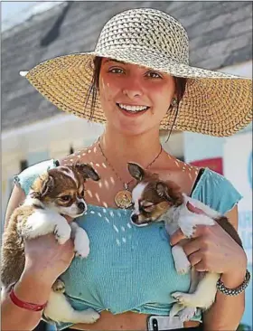  ?? PETE BANNAN - DIGITAL FIRST MEDIA ?? Cassie Volikas of Malvern enjoys the Devon Horse Show with her two longhair chihuahuas puppies, Jade and Lightning.