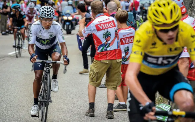  ??  ?? Quintana in the white jersey fixates on Froome as they climb Alpe d’Huez in 2013