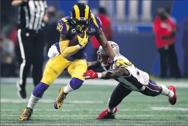  ?? — GETTY IMAGES ?? Rams running back Todd Gurley (left) only touched the ball 11 times in the Rams’ loss to the Patriots in the Super Bowl on Sunday.