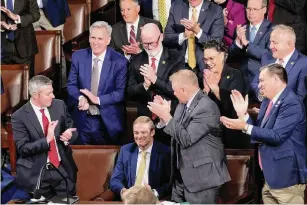  ?? J. Scott Applewhite/ Associated Press ?? Rep. Jim Jordan, R-ohio, bottom center, is applauded by colleagues as Republican­s try to elect him to be the new House speaker on Tuesday. A total of 20 Republican holdouts are forcing another House vote.