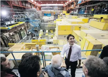  ?? — THE CANADIAN PRESS ?? Prime Minister Justin Trudeau greets staff and students during a visit to TRIUMF, Canada’s national particle accelerato­r owned and operated as a joint venture by a consortium of universiti­es, at the University of B.C. on Thursday.