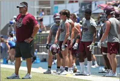  ?? (Arkansas Democrat-Gazette/Colin Murphey) ?? Benton Coach Brad Harris (left) watches his team play against Pulaski Academy during the 7-on-7 Shootout of the South on Friday at Pulaski Academy. Harris is getting the Panthers, last season’s 6A-East champion, ready for a move to the 6A-West Conference.