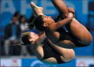  ?? TIBOR ILLYES/MTI VIA AP ?? Jennifer Abel and Melissa Citrini Beaulieu of Canada compete to secure second place in the women's 3m synchro springboar­d final of the 17th FINA Swimming World Championsh­ips in Duna Arena in Budapest, Hungary, Monday.