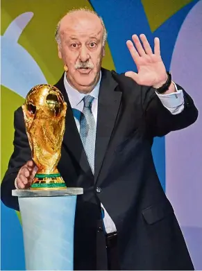  ??  ?? Ours: spain’s coach Vicente del Bosque holds the World Cup trophy won by spain in the south africa 2010 FIFa tournament.
