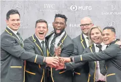  ?? AFP ?? South Africa’s Siya Kolisi, third left, and his Rugby World Cup-winning teammates pose with the Laureus team of the year award.