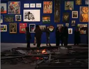  ?? SAMAR HAZBOUN — THE NEW YORK TIMES ?? Paintings meant to evoke Gaza's sky and sea are hung on a blue wall at the Palestinia­n Museum in Birzeit this month.