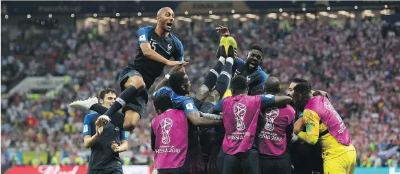  ?? SHAUN BOTTERILL ?? Kylian Mbappe of France celebrates with teammates after scoring in the 2018 FIFA World Cup final between France and Croatia on July 15 in Moscow.