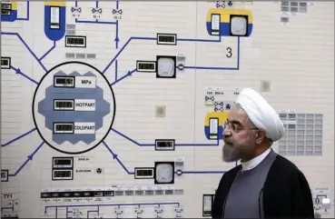  ?? The Associated Press ?? DEAL UNRAVELS: In this Jan. 13, 2015, file photo released by the Iranian President’s Office, President Hassan Rouhani visits the Bushehr nuclear power plant just outside of Bushehr, Iran. Iran announced Sunday it increased its enrichment of uranium, breaking another limit of its faltering 2015 nuclear deal with world powers and further heightenin­g tensions between Tehran and the U.S.