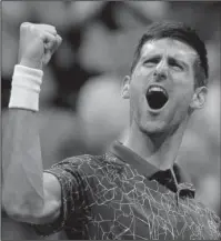  ?? The Associated Press ?? FINALIST DJOKOVIC: Novak Djokovic celebrates Friday after defeating Kei Nishikori in the semifinals of the U.S. Open in New York.