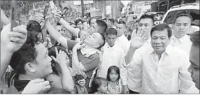  ??  ?? President Rodrigo Duterte waves to his supporters. (Photo: theconvers­ation)