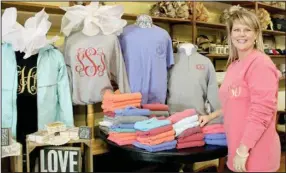  ?? LYNN KUTTER ENTERPRISE-LEADER ?? Shannon Stearman and her husband, Travis, have the Crescent Store in Prairie Grove. The store sells a variety of items, including monogramme­d shirts, school spirit clothes and decorative items.