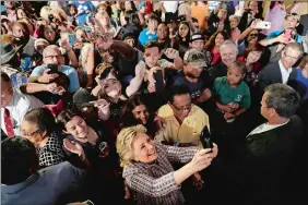  ?? MATT ROURKE/AP PHOTO ?? Democratic presidenti­al candidate Hillary Clinton meets with audience members during a campaign stop Friday in Fort Pierce, Fla.