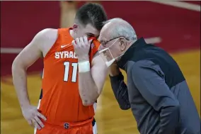  ?? ELISE AMENDOLA - THE ASSOCIATED PRESS ?? FILE - In this Dec. 12, 2020, file photo, Syracuse coach Jim Boeheim talks with guard Joseph Girard III during the first half of the team’s NCAA college basketball game against Boston College in Boston.