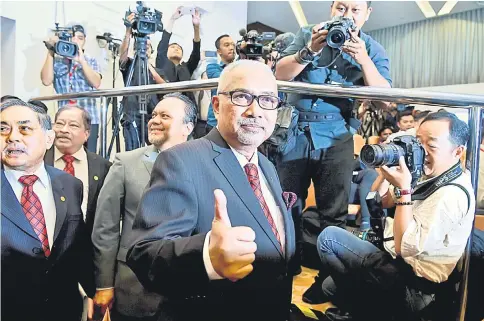  ??  ?? Mohd Hashim gives the thumbs-up at the press conference to announce the nomination and election dates. — Bernama photo