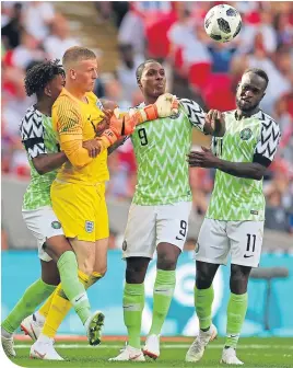  ??  ?? Nigeria’s Odion Ighalo,Victor Moses and Alex Iwobi try to get the ball from Jason Pickford after pulling a goal back to make it 2-1